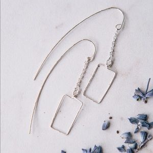 Long rectangle silver earrings.